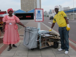 Cardboard recycler Victoria Bubu on the left, being assisted by Sibusiso Zulu