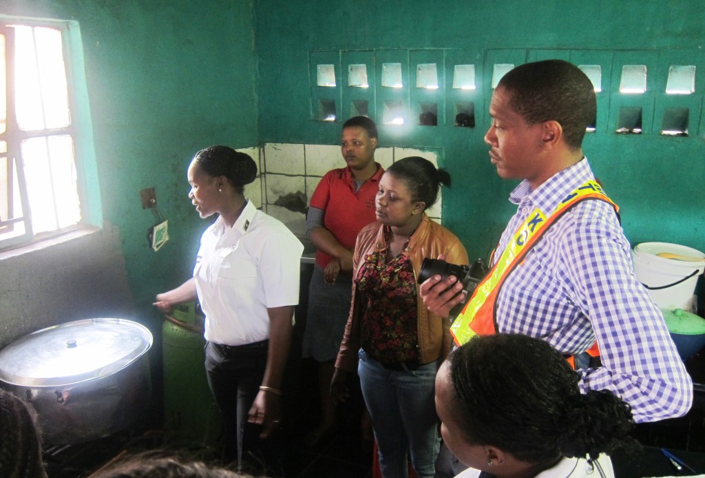 The workplace-safety audit delegation inspecting a food cook's stall. Image: Tasmi Quazi.