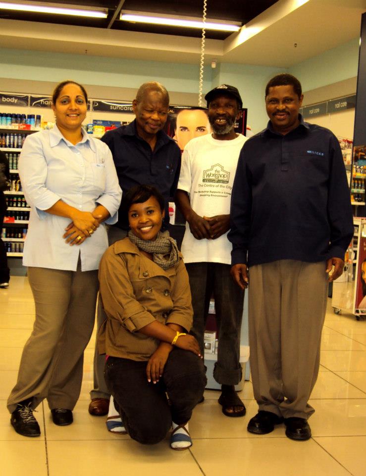 Clicks management at the Workshop Shopping Centre with informal recycler, Afrika Ntuli, who sorts and removes their cardboard and plastic waste recyclables. Picture: Tasmi Quazi 